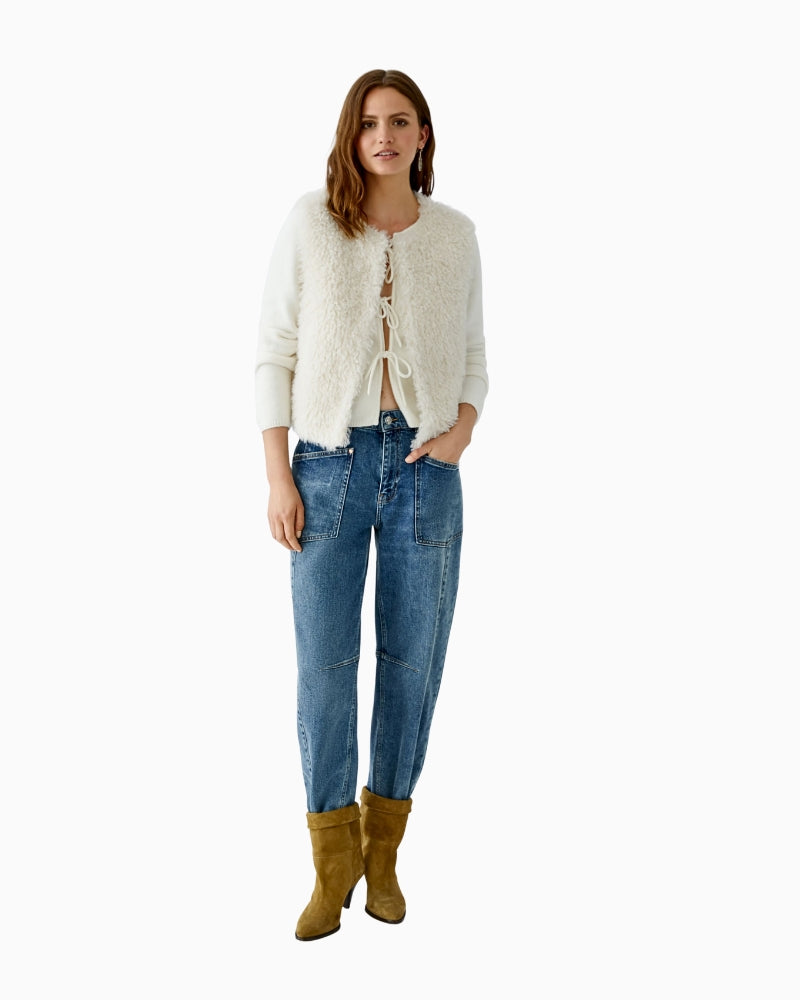 Oui sleeveless faux fur jacket paired with denim jeans