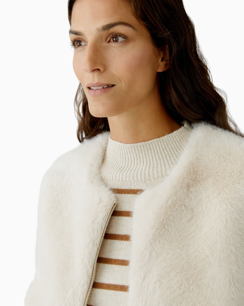 Close-up of mink-look faux fur texture on Oui waistcoat in off white