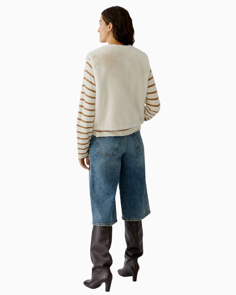 Back view of off white faux fur waistcoat showing straight fit