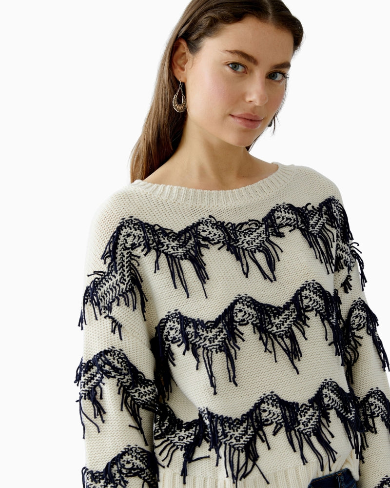 Side view of white and blue fringe jumper with relaxed fit