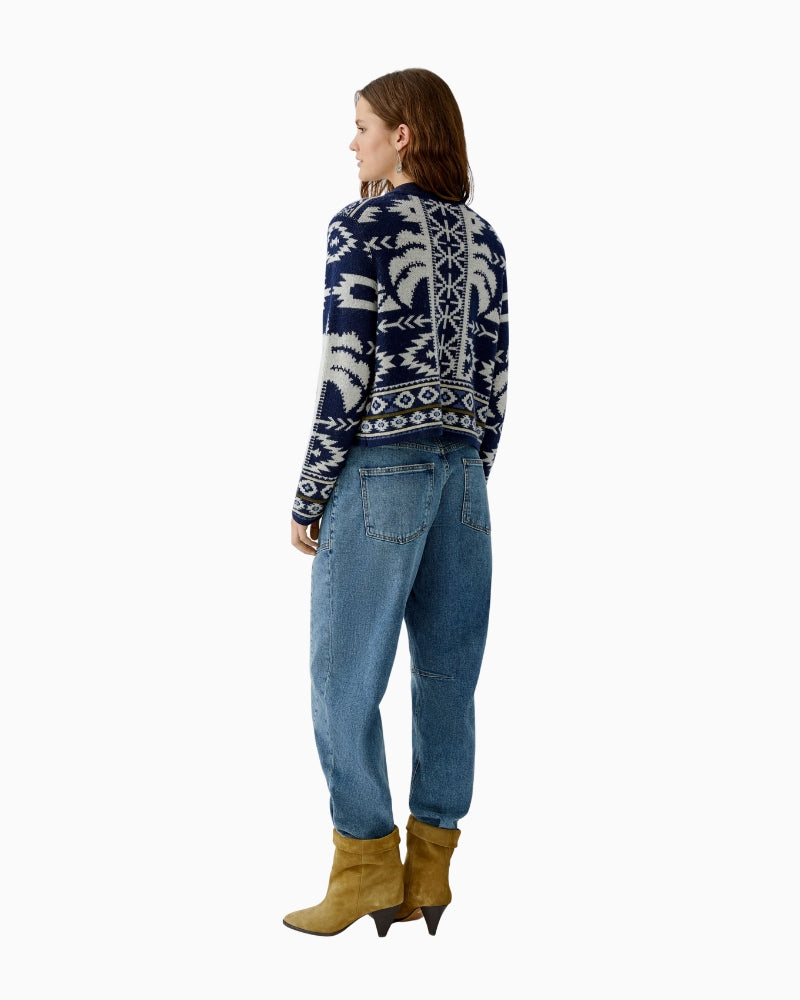 Back view of patterned knit with olive and blue tones