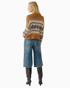 Model back view of Oui Norwegian knit pullover styled casually with jeans