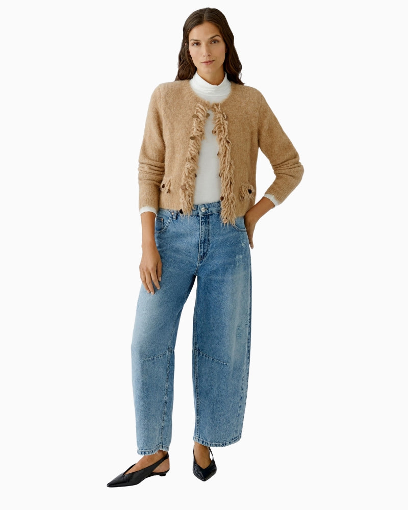 Oui knit jacket in beige layered over simple blouse and jeans
