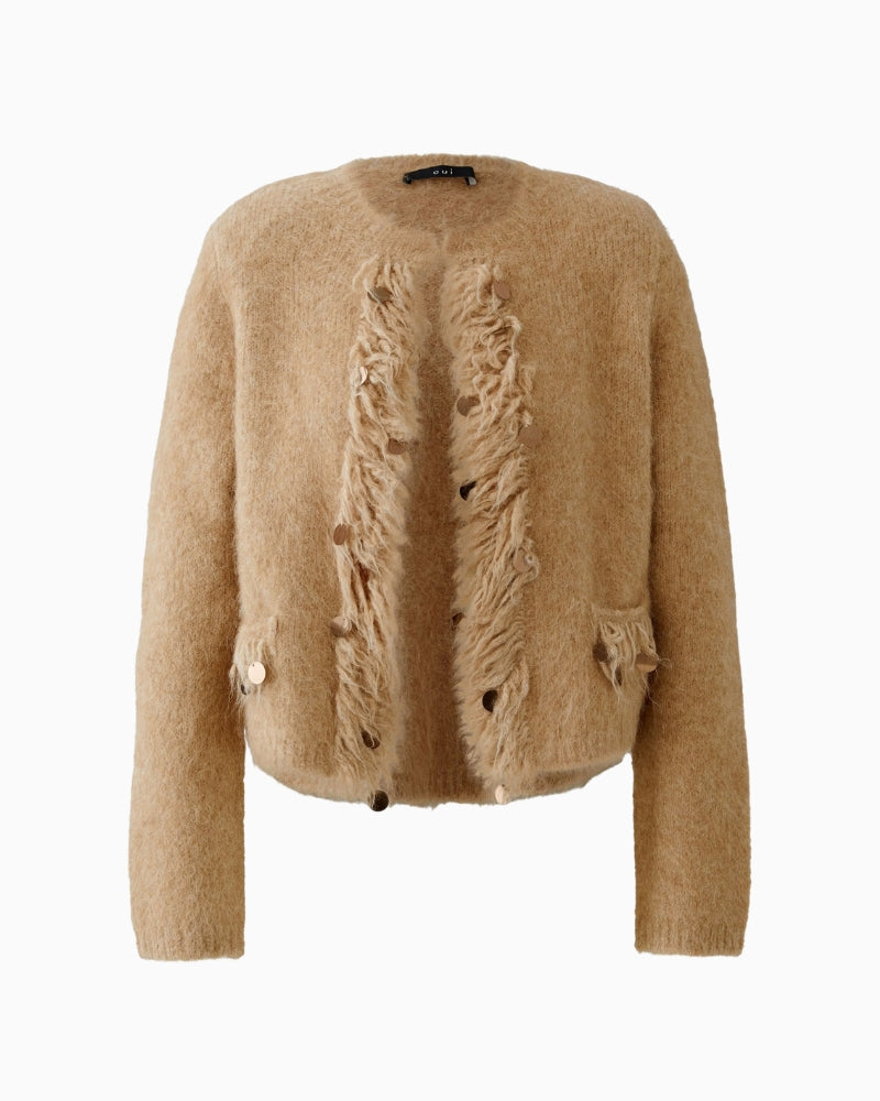 Front view of beige cropped knit jacket showing shoulder pads and trim