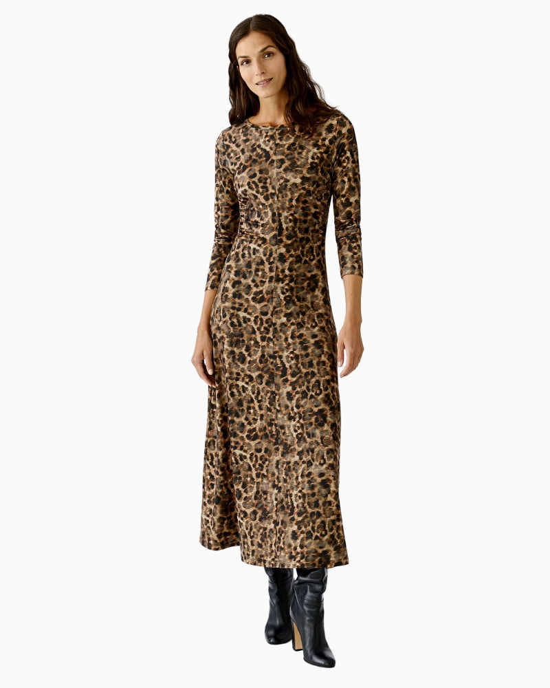Model wearing Oui leopard maxi dress with long fitted silhouette paired with boots