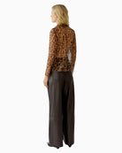 Back view of leopard print mesh top with straight cut and sheer fabric
