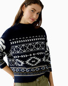 Side view showing slightly cropped length and relaxed fit of jacquard knit jumper