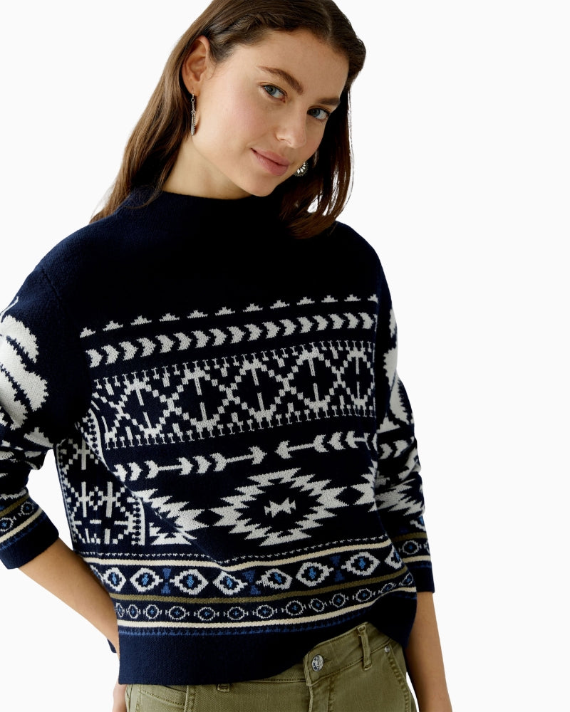 Side view showing slightly cropped length and relaxed fit of jacquard knit jumper
