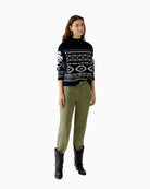 Model wearing Oui Nordic knit pullover styled with jeans and ankle boots for winter look