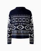 Close-up of cream jacquard detailing on navy knit fabric