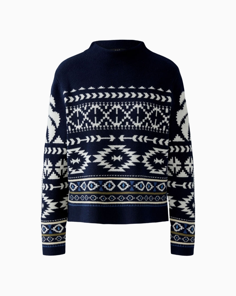 Close-up of cream jacquard detailing on navy knit fabric