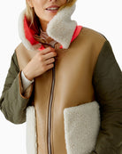 Close-up of quilted nylon and faux leather fabric mix on reversible jacket