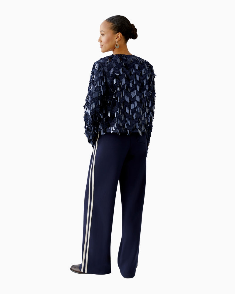 Oui mesh jacket with sequins layered over blouse and loose jeans