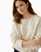 Close-up of horizontal sleeve-to-body knit construction