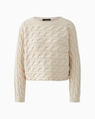 Model wearing cropped grey knit jumper