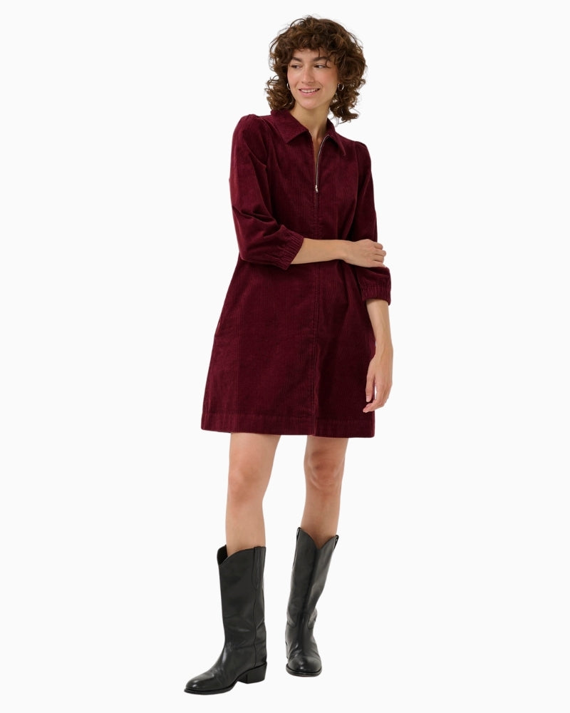 Part Two cord dress styled with black boots for a cosy autumn look