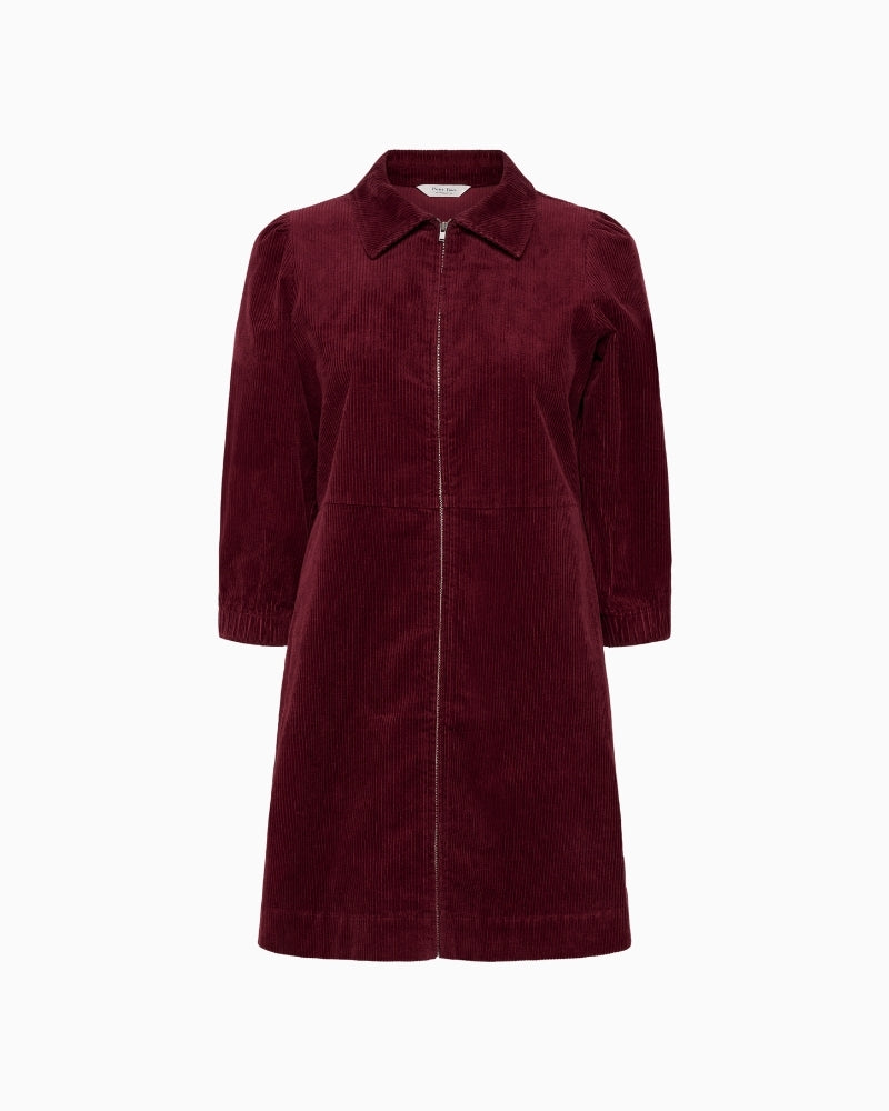 Front view of burgundy corduroy dress by Part Two with zip closure and classic collar
