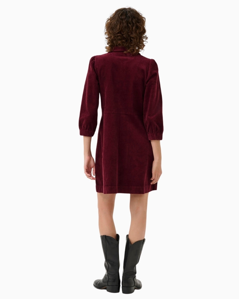 Back view of above-the-knee length cord dress with relaxed fit