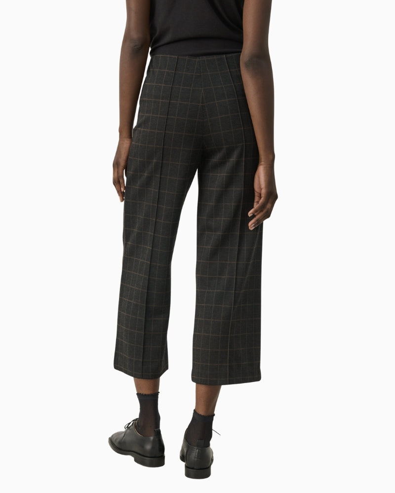 Back view of Ilisan trousers showing relaxed fit and high waist