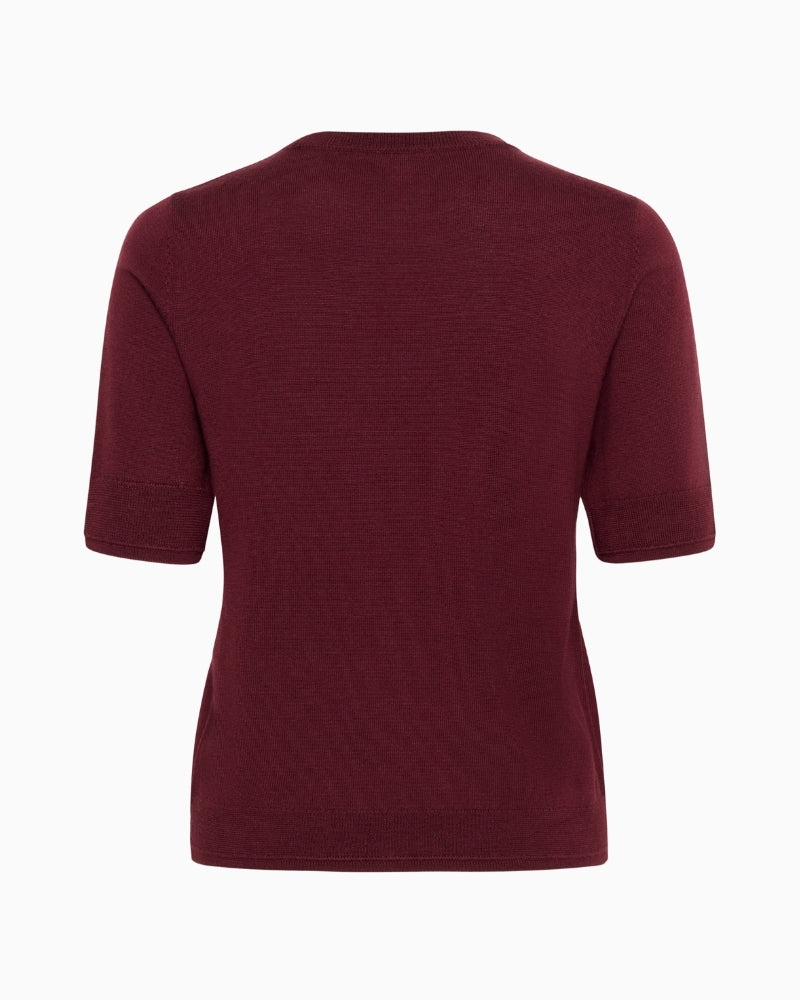 Back view of wool top with short sleeves and soft drape