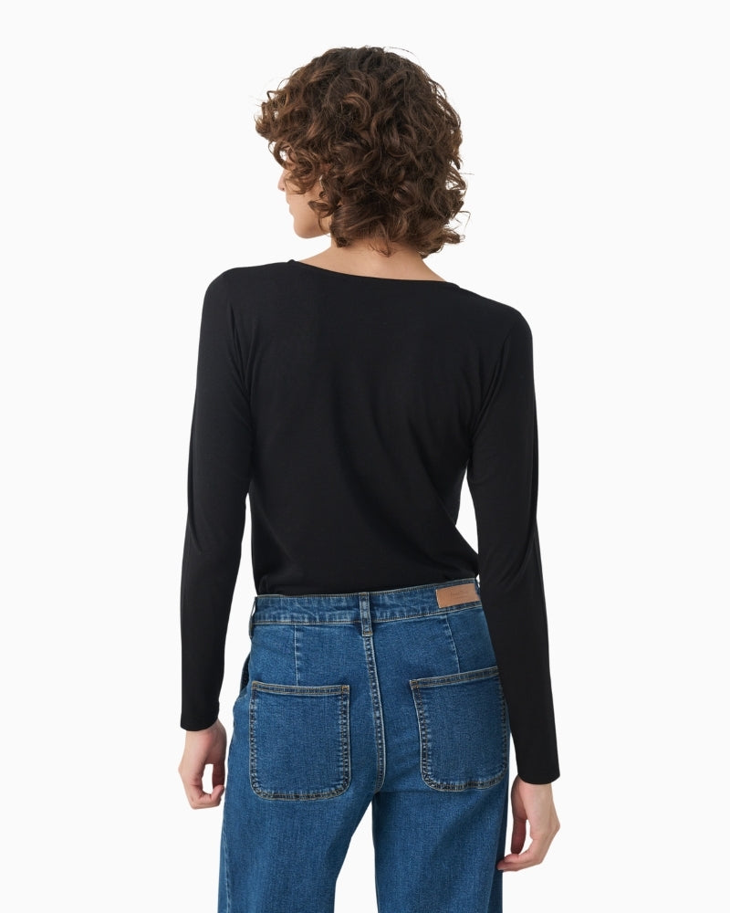 Back view of long sleeve slim tee with soft drape and stretch fabric