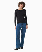 Tee laid flat showing full sleeve length and slim fit design