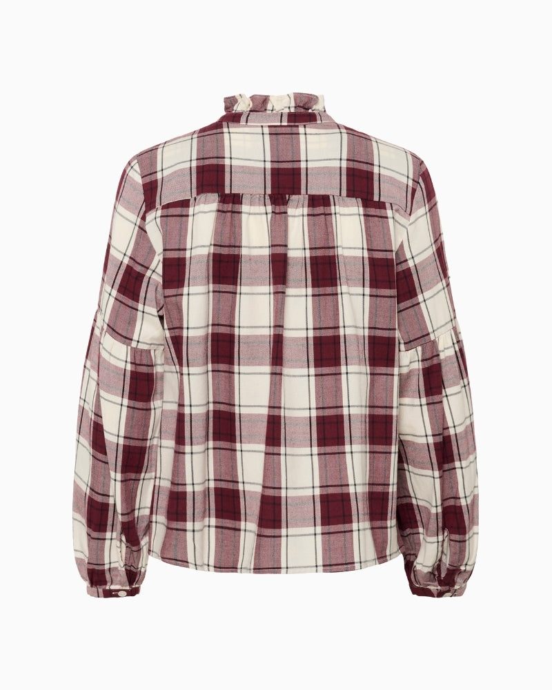 Back view of relaxed check blouse with feminine detailing and clean shape