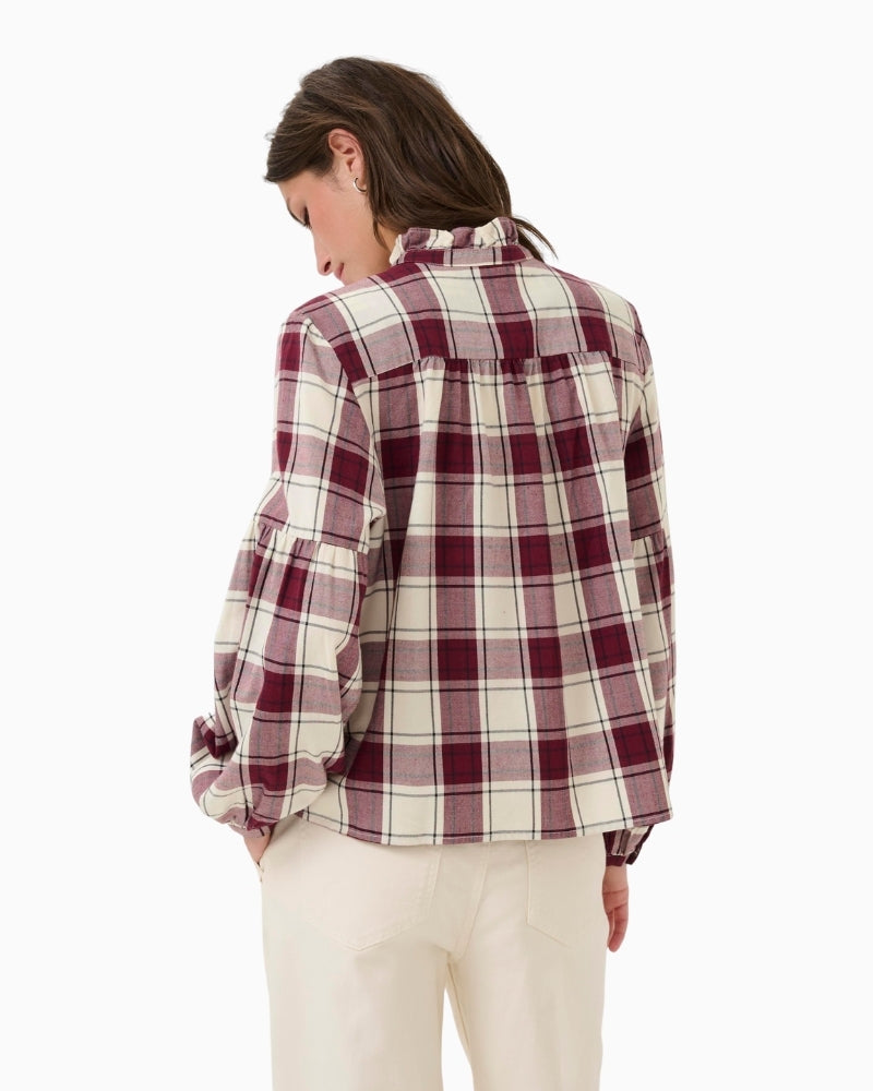 Back view of relaxed check blouse with feminine detailing and clean shape