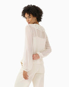 Back view of long sleeve sheer blouse in airy viscose