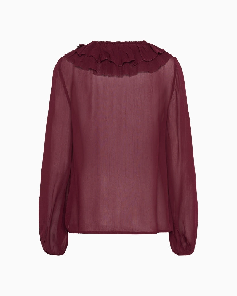 Back view of long-sleeve sheer burgundy blouse with soft drape
