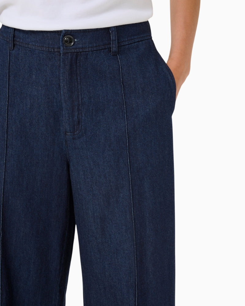 Close up of Straight-leg denim trousers by Part Two with pressed creases and side pockets