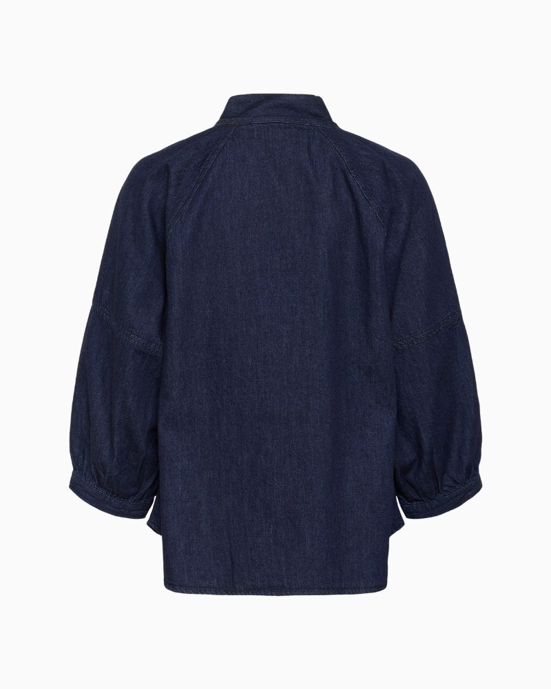 Back view of cotton denim blouse with soft structure and cropped sleeves