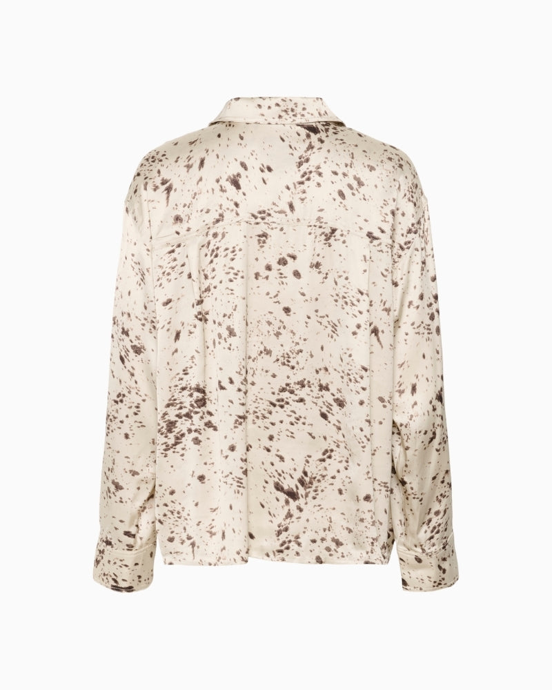 Back view of relaxed fit blouse showing long sleeves and soft drape