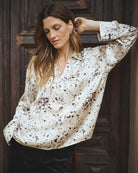 Full-length look of model wearing oversized printed blouse by Part Two in size 36