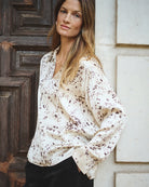 Side view of Sheenapw blouse styled with trousers, showing loose silhouette