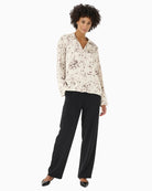 Full-length look of model wearing oversized printed blouse by Part Two in size 36