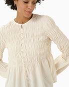 Close-up of smooth viscose polyamide fabric in cream