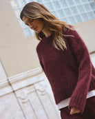 Side view of lightweight knit showing ribbed cuffs and soft texture
