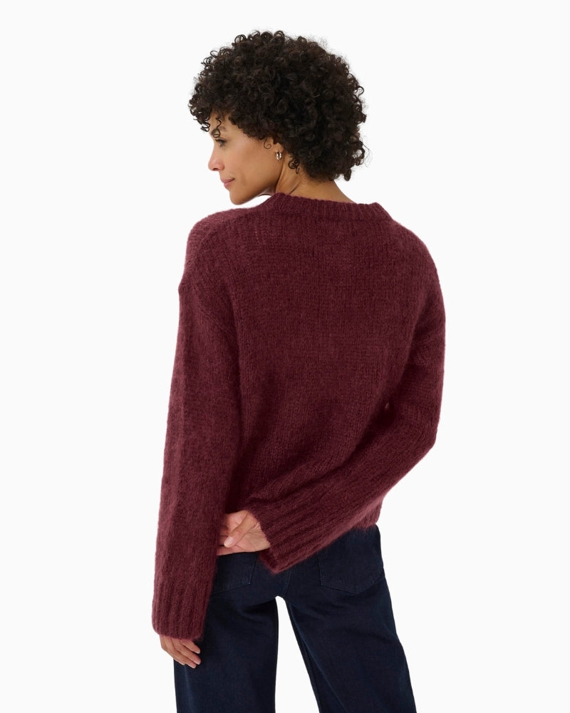 Back view of Sille pullover in burgundy with long sleeves and relaxed shape