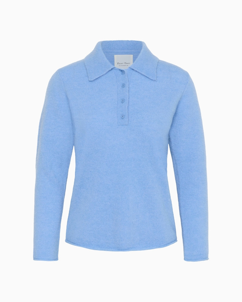 Front view of relaxed fit blue crew neck jumper
