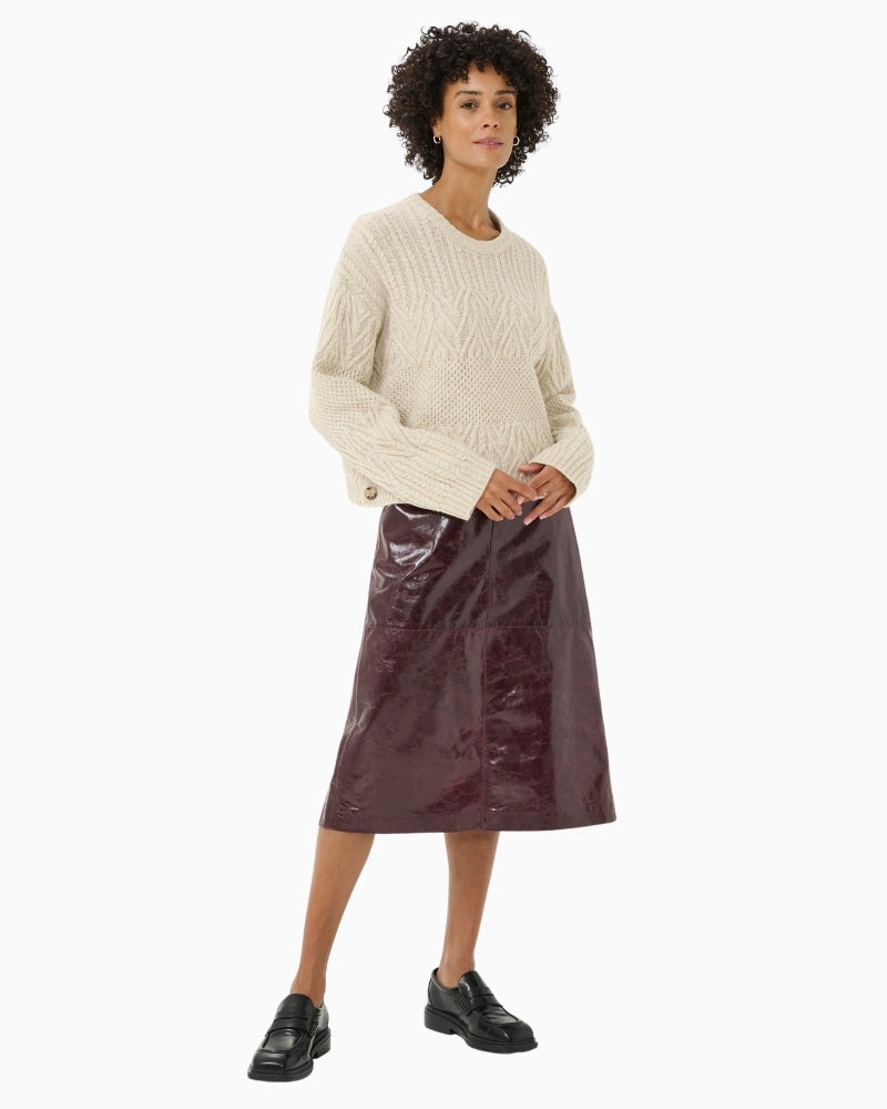 Model wearing cream Sindy pullover styled with jeans and boots