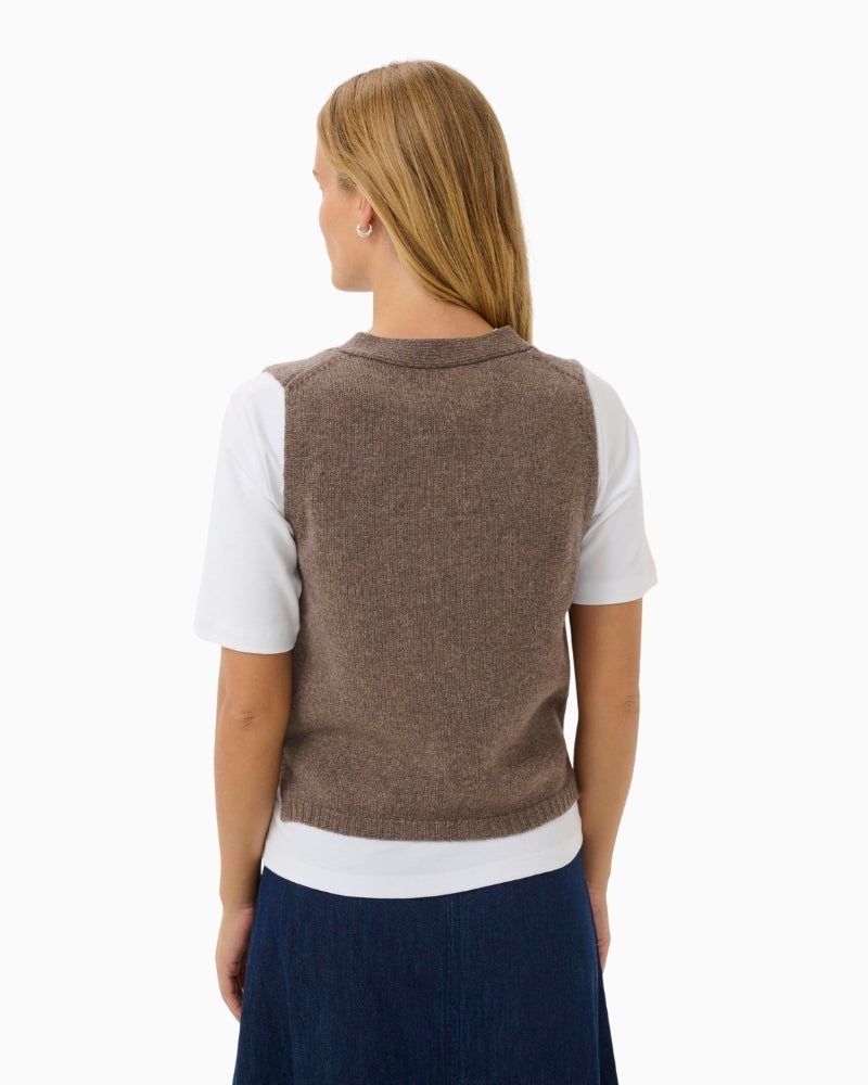 Back of Layered styling of SylvaPW waistcoat over shirt for casual office look