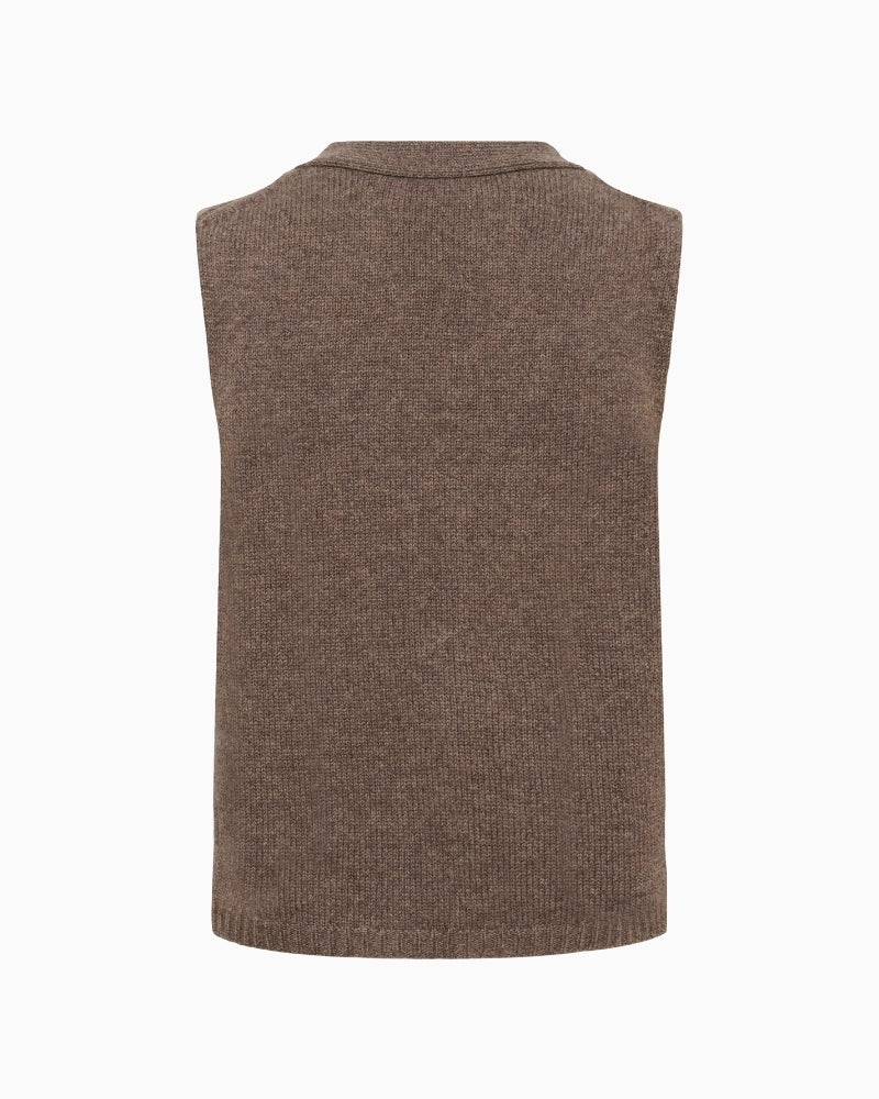 Back of Layered styling of SylvaPW waistcoat over shirt for casual office look