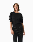 Black short-sleeved shimmer blouse by Part Two with puff sleeves