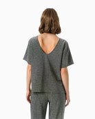 Back view of Part Two shimmer top with clean, draped finish
