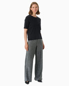 Full-length view of relaxed fit trousers with comfortable waistband