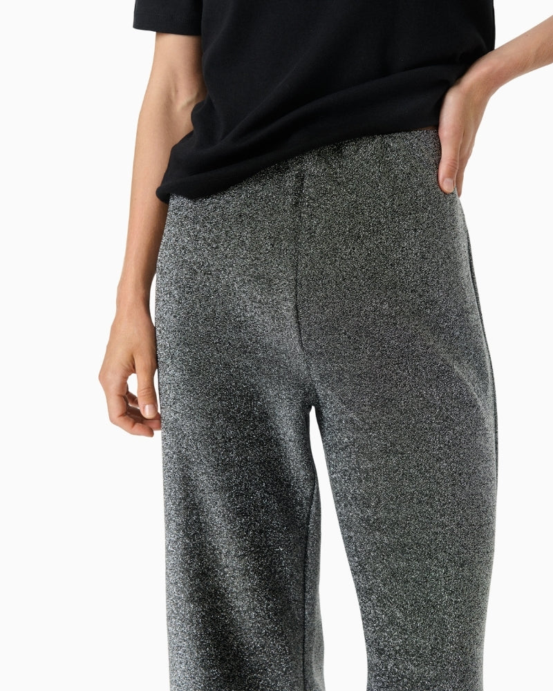 Close-up of metallic thread detail in soft stretch fabric