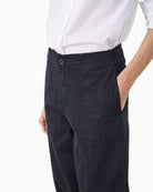 Side angle showing slim straight leg and visible seams