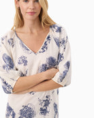 Close-up of neckline and vibrant flower print on Part Two linen blend summer dress