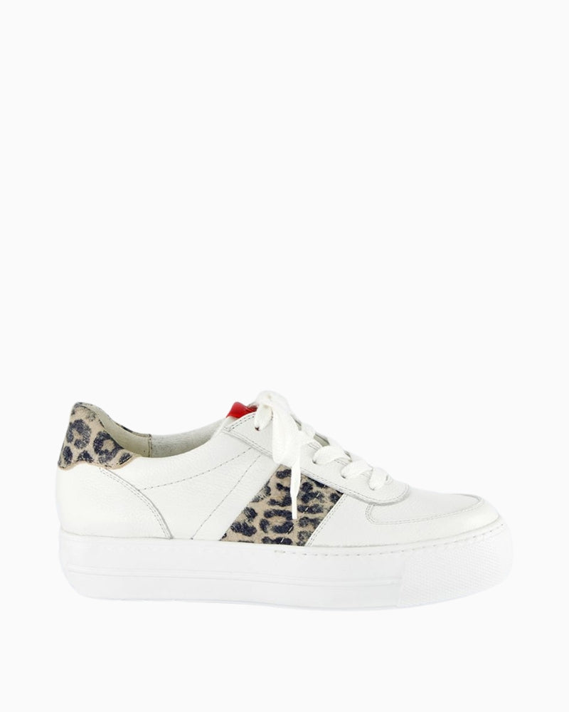 Side view of white and animal print sneakers with platform sole
